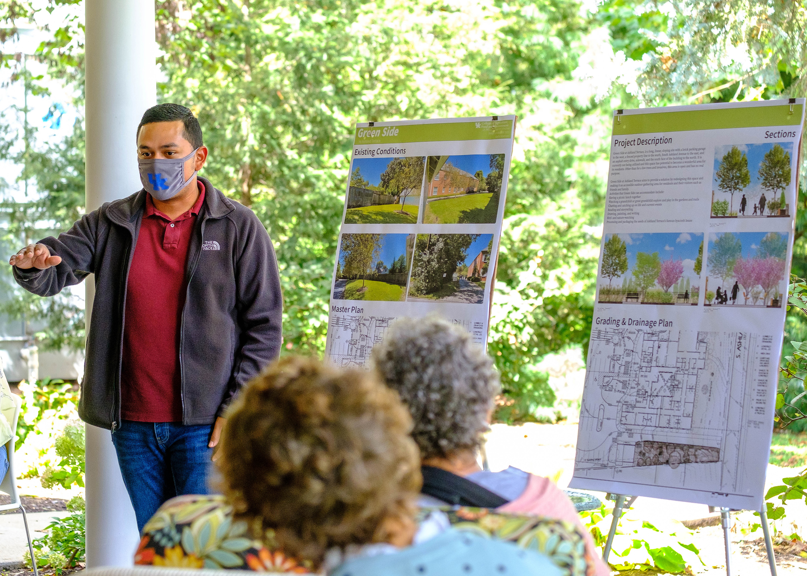 Student presenting work to members of Ashland Terrace.