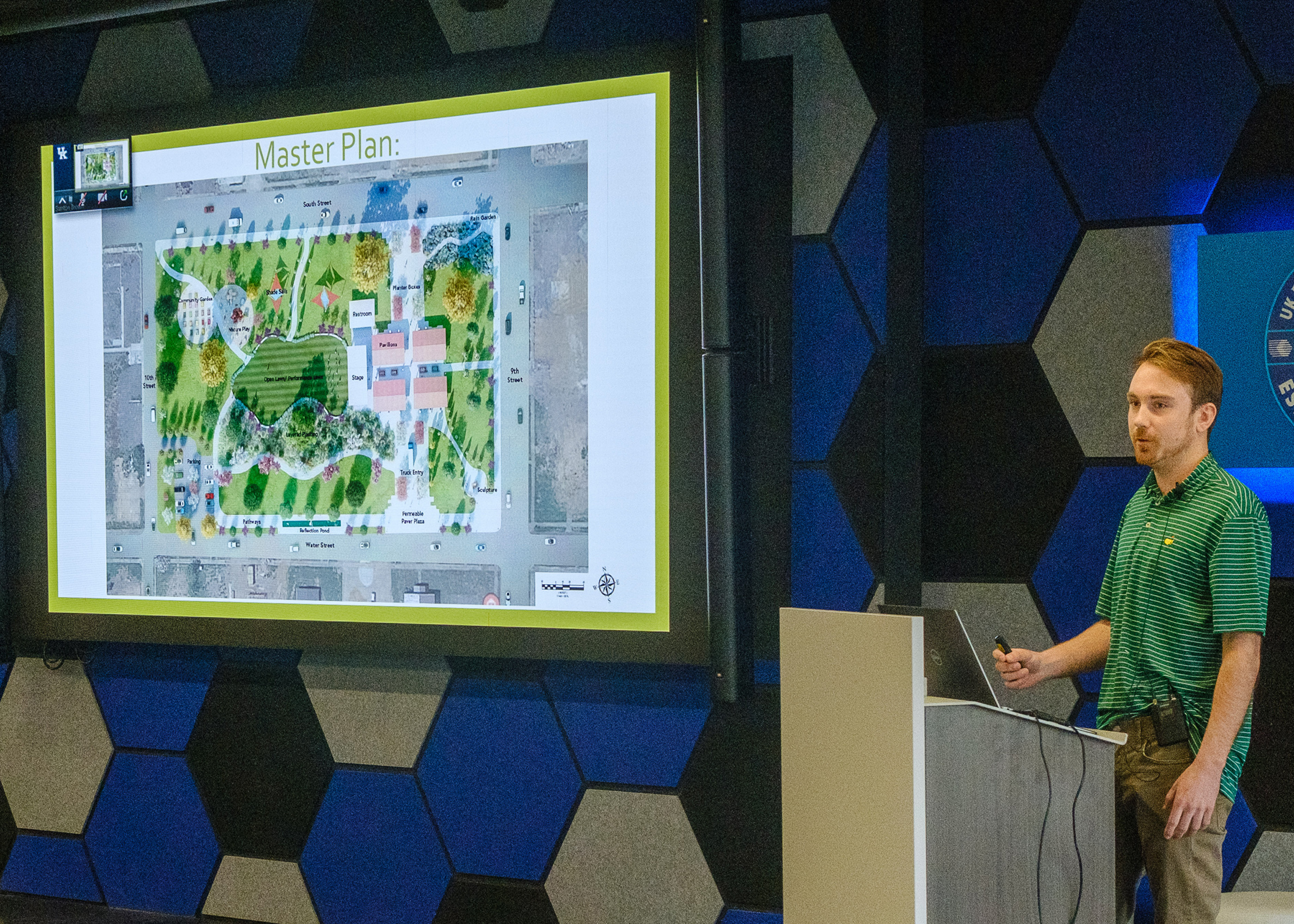 Photograph of student presenting his design for Mayfield, KY farmer's market