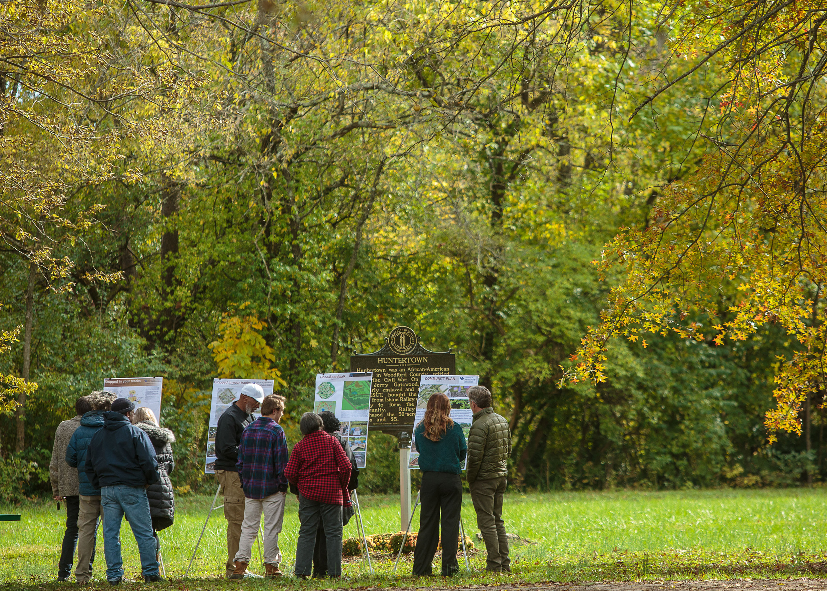 Students and community members looking at design plans in Huntertown.