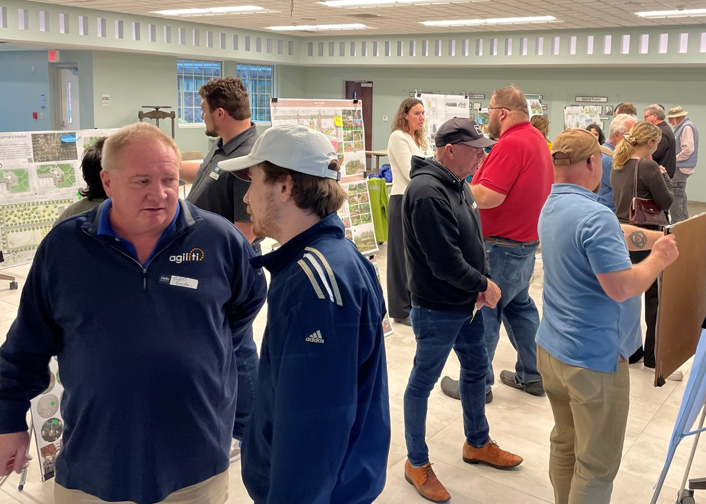 Students and community members looking at design plans in Huntertown.