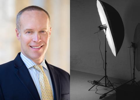 Image of Billy Van Pelt next to photographic lighting equipment